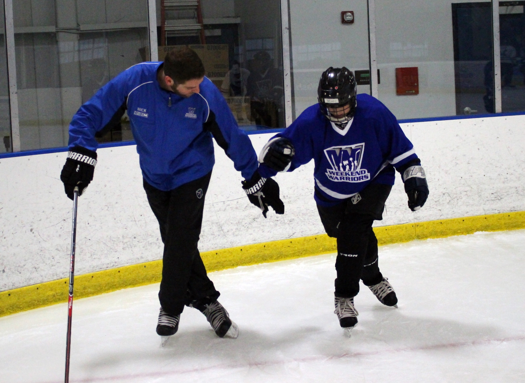 Coach Nick helps a player with her crossover