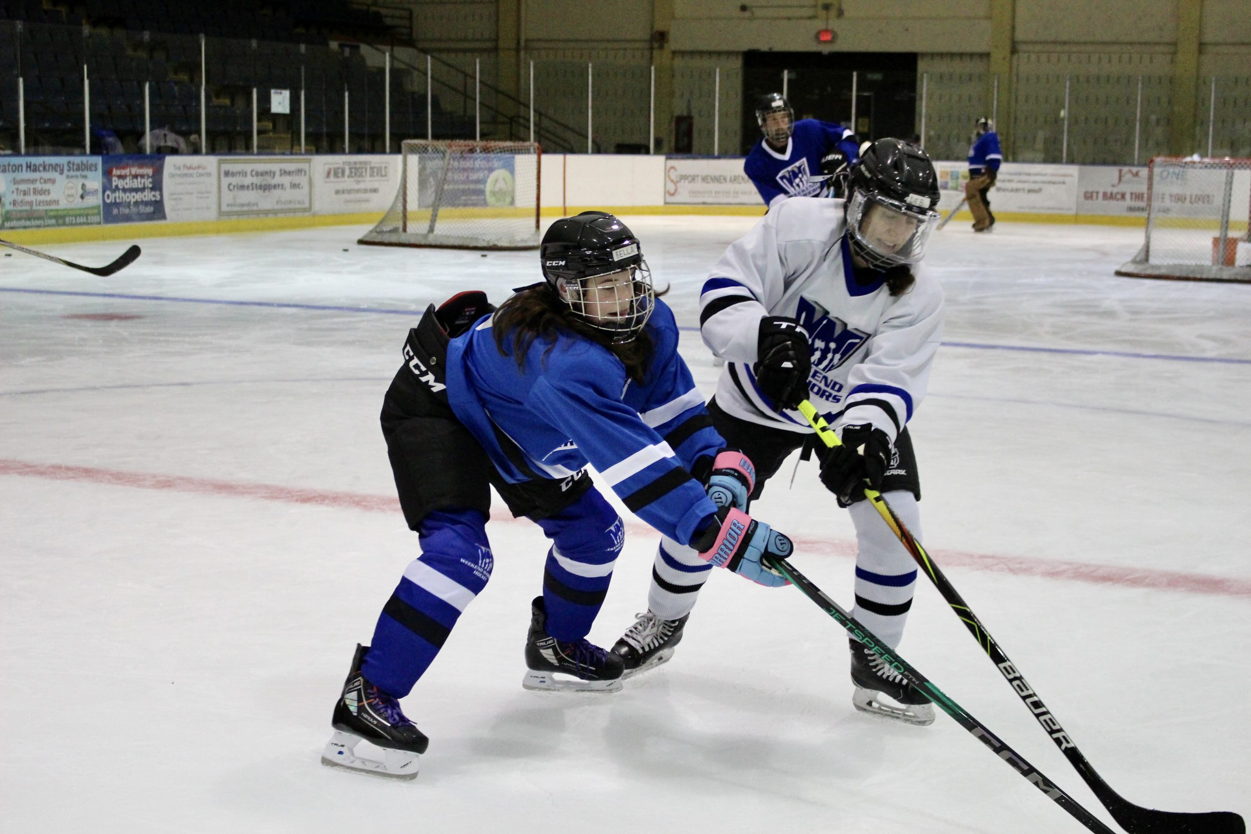 Two campers battle it out for the puck